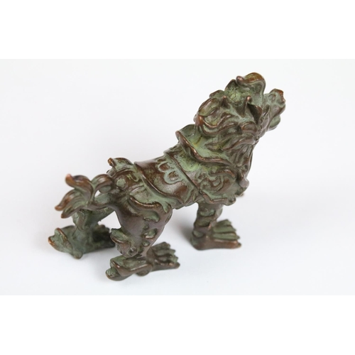 332 - A Chinese bronze ornamental lion in the traditional form