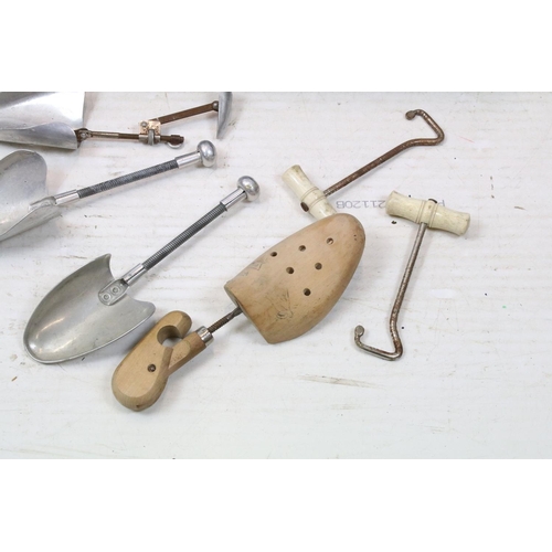 502 - Pair of wooden shoe lasts, aluminium shoe lasts, boot pulls and riding spurs