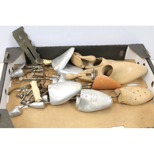 502 - Pair of wooden shoe lasts, aluminium shoe lasts, boot pulls and riding spurs