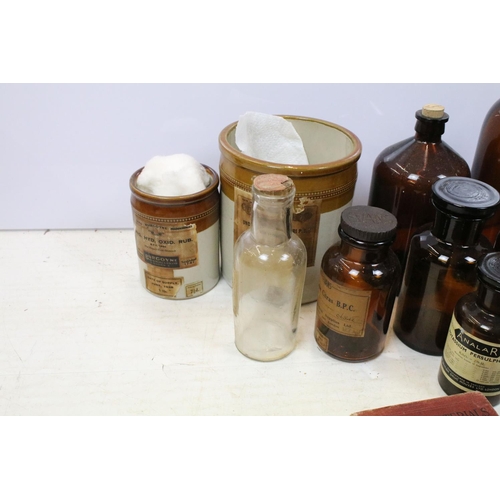 508 - Collection of apothecary / medical related items to include glass bottles, jars, books, first aids s... 