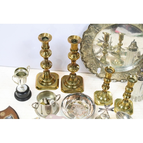 515 - Mixed metal ware to include two pairs of brass candlesticks, silver plated tray with embossed, decor... 