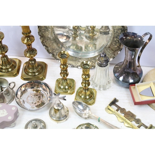 515 - Mixed metal ware to include two pairs of brass candlesticks, silver plated tray with embossed, decor... 