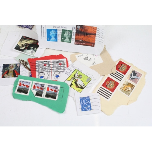 357 - A small collection of mixed stamps to include The Stand Album and loose stamps, school children's co... 