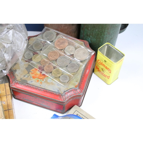 358 - A box of mixed collectables to include coins, military badges, walllets and purses, marbles, postcar... 