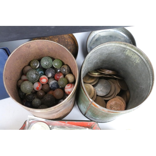 358 - A box of mixed collectables to include coins, military badges, walllets and purses, marbles, postcar... 