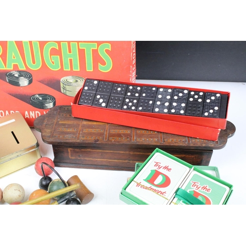 361 - A group of vintage toys and games to include draughts, dominoes and a table top croquet set.