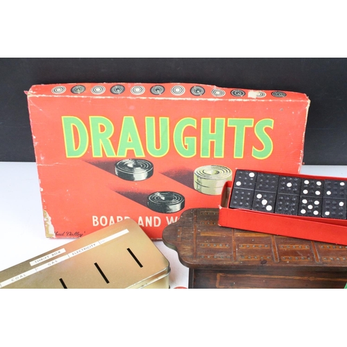 361 - A group of vintage toys and games to include draughts, dominoes and a table top croquet set.