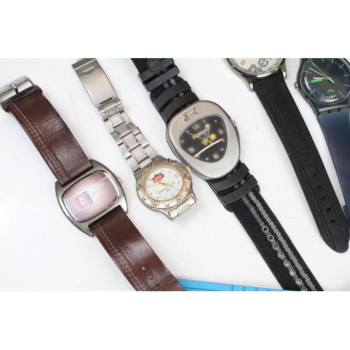 362 - A large collection of mainly contemporary ladies and gents wristwatches.