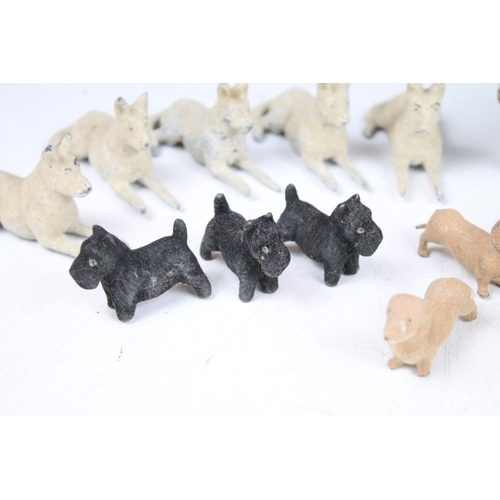 365 - Vintage C 1940/50's Barret & Sons lead and felt covered dogs of various breeds (29 in total)