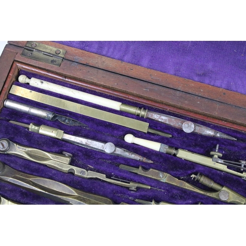 379 - A vintage wooden cased drawing set to include compasses etc..