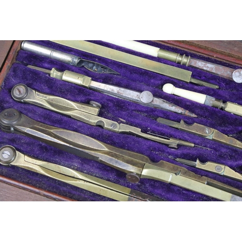 379 - A vintage wooden cased drawing set to include compasses etc..