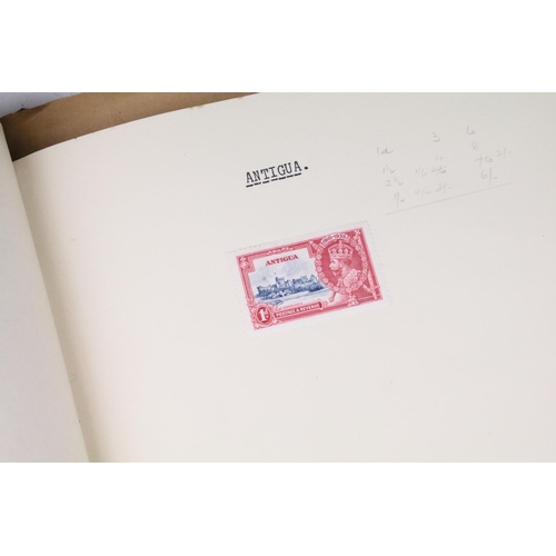 523 - A stamp album containing stamps marking the silver jubilee of King George V from the UK and Commonwe... 