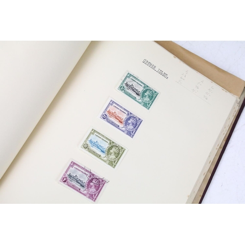 523 - A stamp album containing stamps marking the silver jubilee of King George V from the UK and Commonwe... 