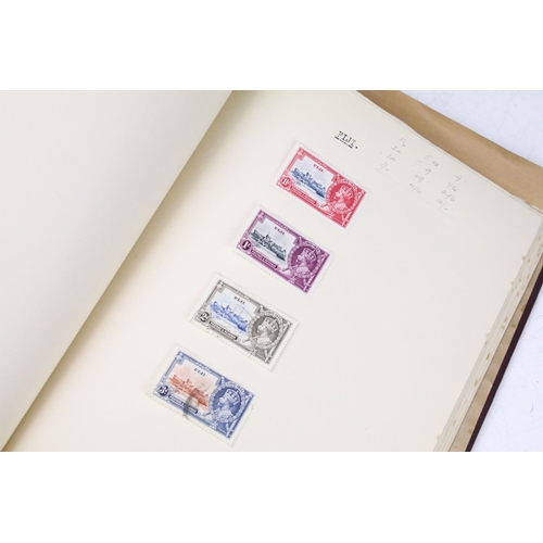 523 - A stamp album containing stamps marking the silver jubilee of King George V from the UK and Commonwe... 