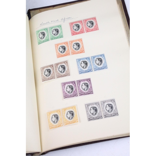 523 - A stamp album containing stamps marking the silver jubilee of King George V from the UK and Commonwe... 