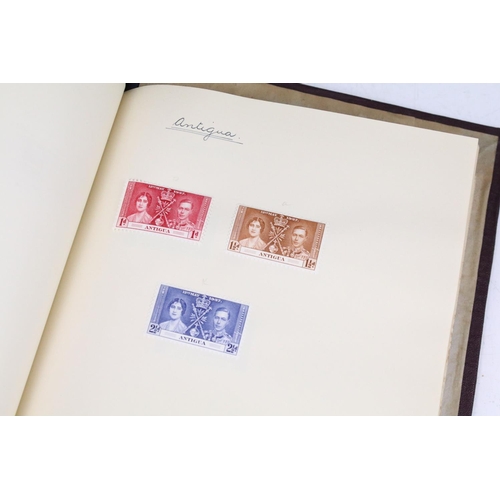 523 - A stamp album containing stamps marking the silver jubilee of King George V from the UK and Commonwe... 