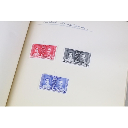 523 - A stamp album containing stamps marking the silver jubilee of King George V from the UK and Commonwe... 