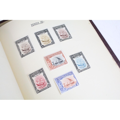 524 - A stamp album containing UK and world stamps to include King Edward VIII together with a UK album in... 