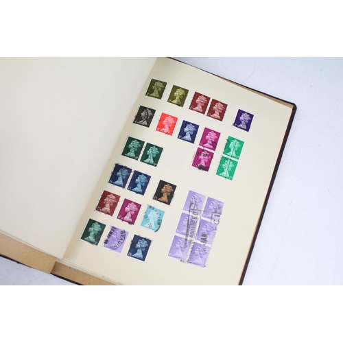 524 - A stamp album containing UK and world stamps to include King Edward VIII together with a UK album in... 