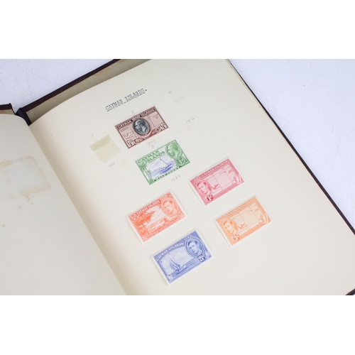 524 - A stamp album containing UK and world stamps to include King Edward VIII together with a UK album in... 