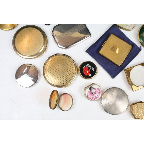 382 - A collection of mainly vintage powder compacts to include silver and Stratton examples.