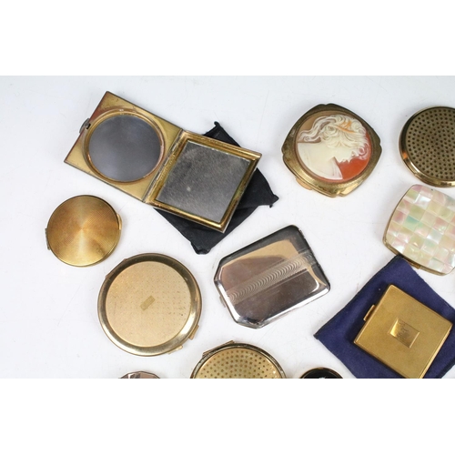 382 - A collection of mainly vintage powder compacts to include silver and Stratton examples.