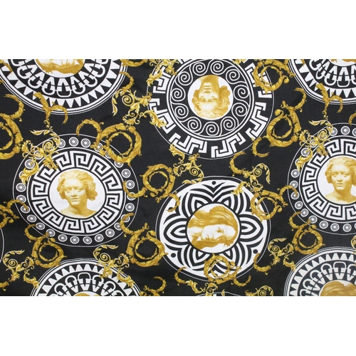 408 - Large piece of black ground Versace style fabric, with repeating spiralling gold acanthus leaves