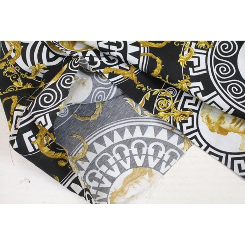 408 - Large piece of black ground Versace style fabric, with repeating spiralling gold acanthus leaves