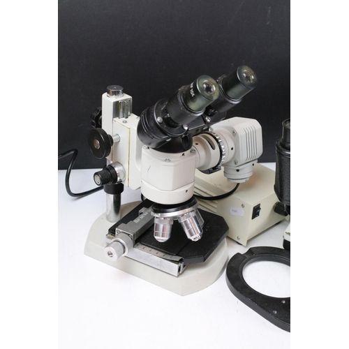 413 - Three binocular / measuring microscopes to include a USSR example