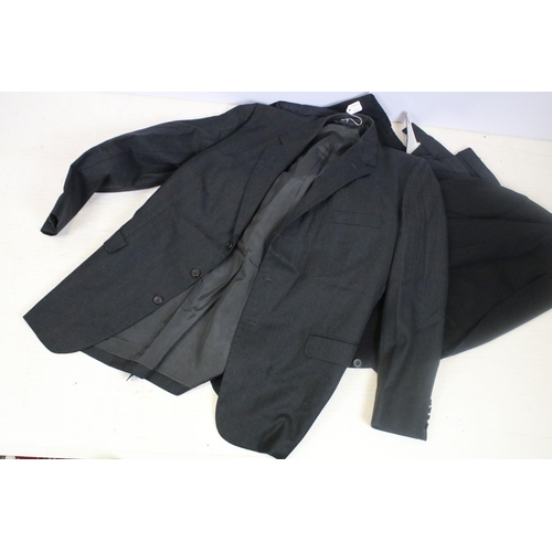 418 - Two dark grey three piece suits, one jacket labelled Jose Luis of Lisboa, together with a Seabal lon... 