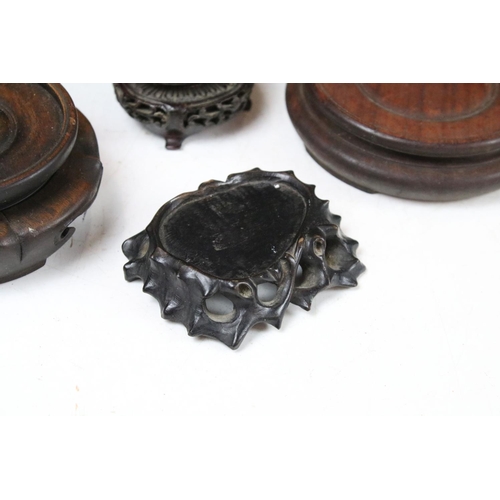 419 - Collection of Oriental hardwood stands to include pierced examples, largest approx 20cm diameter