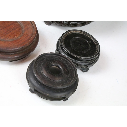 419 - Collection of Oriental hardwood stands to include pierced examples, largest approx 20cm diameter