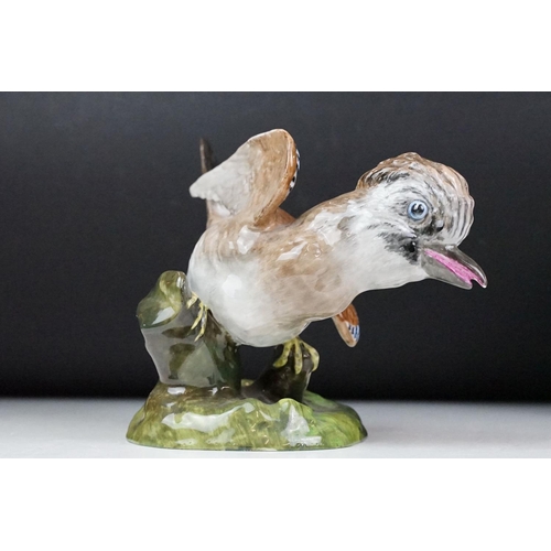 31 - Crown Staffordshire, J T Jones model of a jay, 16.5cm high together with a pair of Staffordshire fla... 