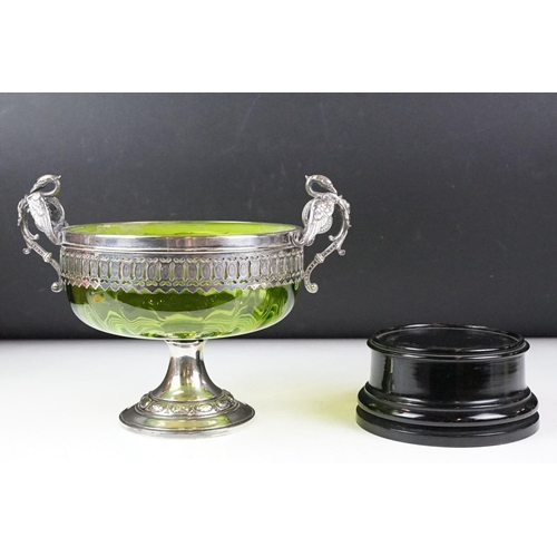 101 - WMF silver plate & green glass footed bowl with twin handles modelled as swans, raised on an ebonise... 