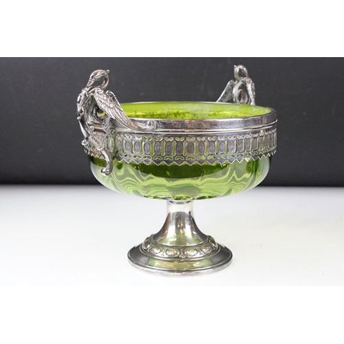 101 - WMF silver plate & green glass footed bowl with twin handles modelled as swans, raised on an ebonise... 