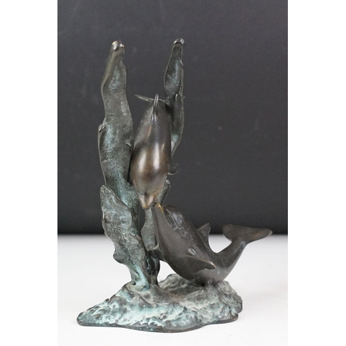 102 - Patinated bronze sculpture of two dolphins amongst sea grasses, 20cm high