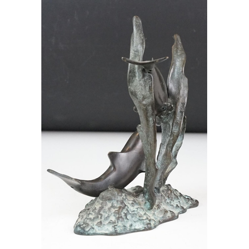 102 - Patinated bronze sculpture of two dolphins amongst sea grasses, 20cm high