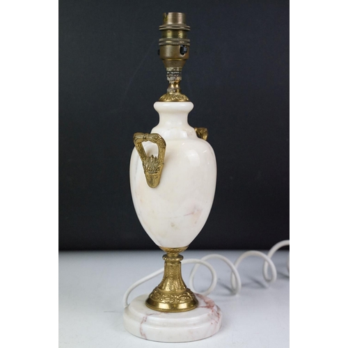 113 - Marble table lamp of baluster form, with gilt metal mounts and twin handles, raised on a circular ba... 