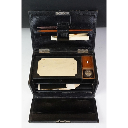 122 - Late 19th / early 20th century leather clad stationery box, the contents to include dip pen, inkwell... 