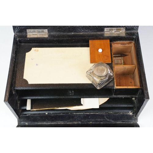 122 - Late 19th / early 20th century leather clad stationery box, the contents to include dip pen, inkwell... 