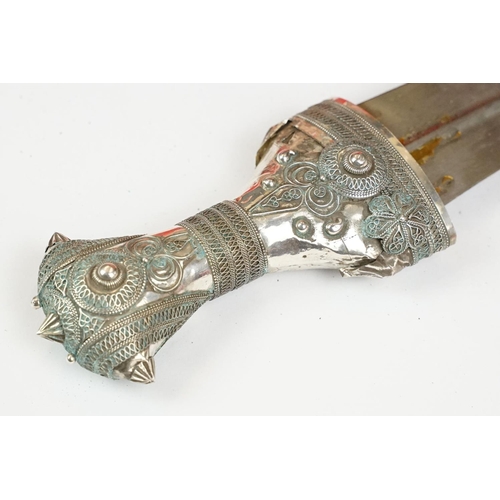 186 - A late 19th / early 20th century Yemin silver mounted over leather sheath Jambiya.