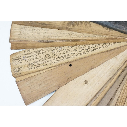 193 - An antique Sri Lanka palm leaf manuscript comprising Buddhist mantras.