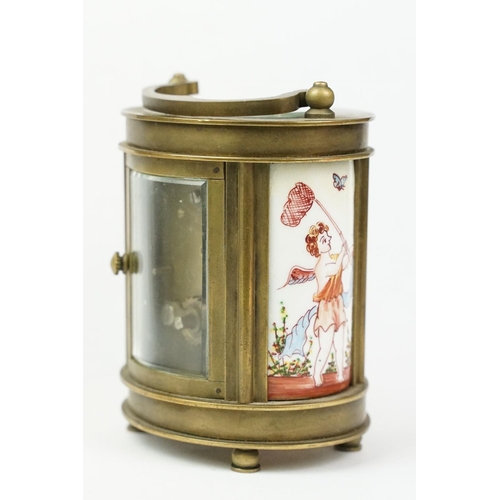 202 - An antique French miniature carriage clock, brass cased with beveled glass panels, decorative Cherub... 