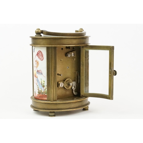 202 - An antique French miniature carriage clock, brass cased with beveled glass panels, decorative Cherub... 