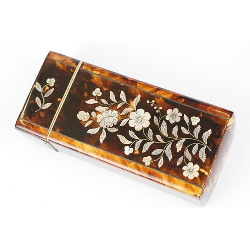 210 - An early 20th century tortoiseshell spectacle case with mother of pearl floral decoration. (CITES re... 