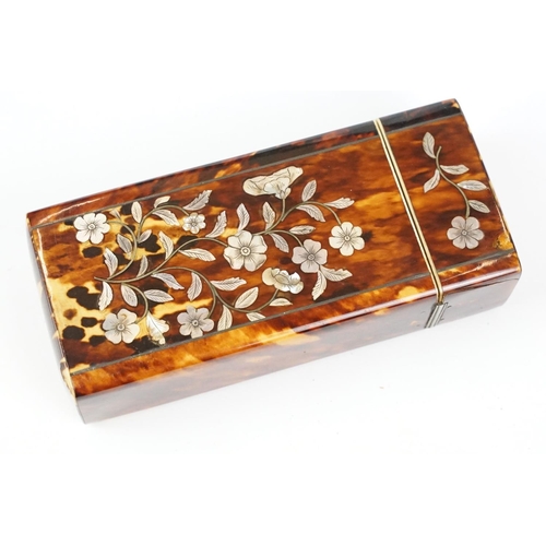 210 - An early 20th century tortoiseshell spectacle case with mother of pearl floral decoration. (CITES re... 