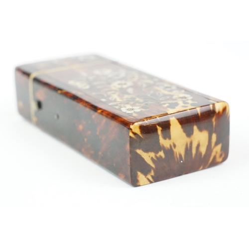 210 - An early 20th century tortoiseshell spectacle case with mother of pearl floral decoration. (CITES re... 