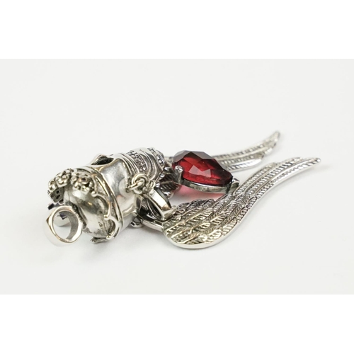 230 - A large silver crowned skull and wings pendant, marked 925 to the verso.