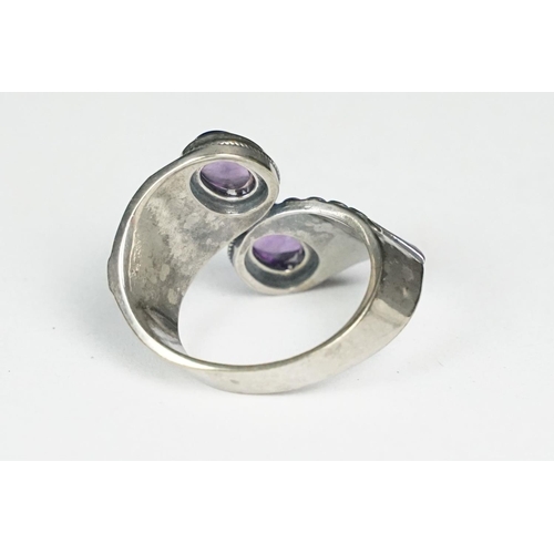 249 - A ladies silver double amethyst cabochon dress ring, marked 925 to the inner shank.