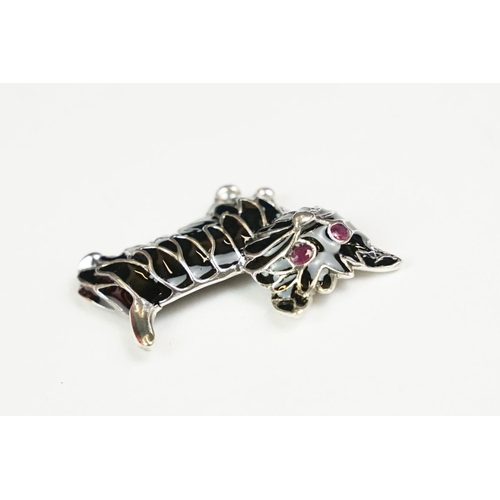 265 - Silver and plique a jour dog brooch with ruby eyes